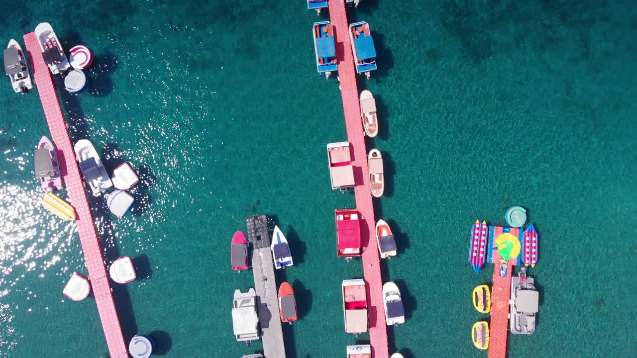 Aerial Footage over Deck Marina With Speed boats Top Down view
