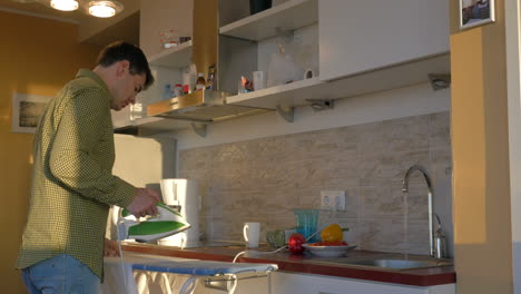 man ironing with steam