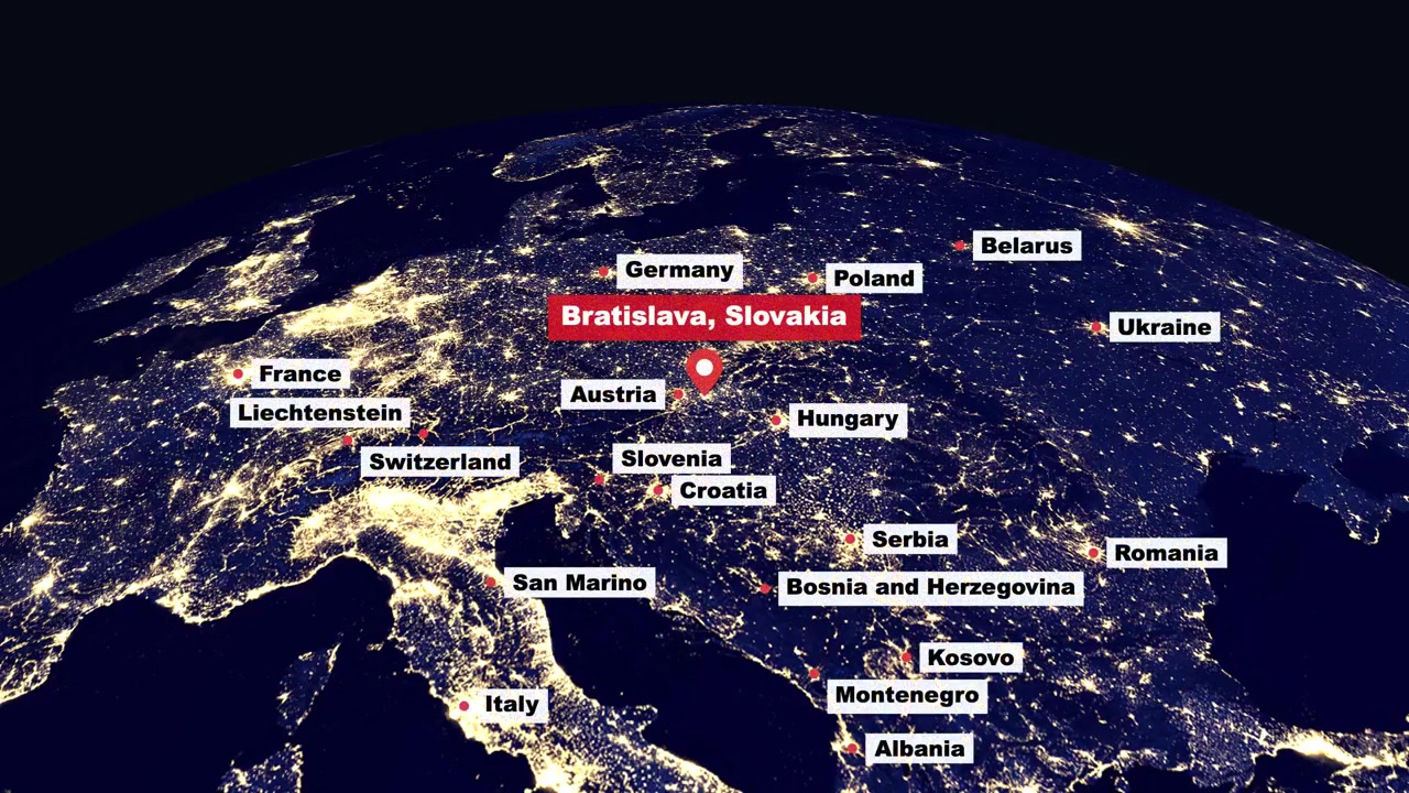 Digital jordglob roterar och zoomar in på en nattvy över Bratislava och omgivande europeiska länder