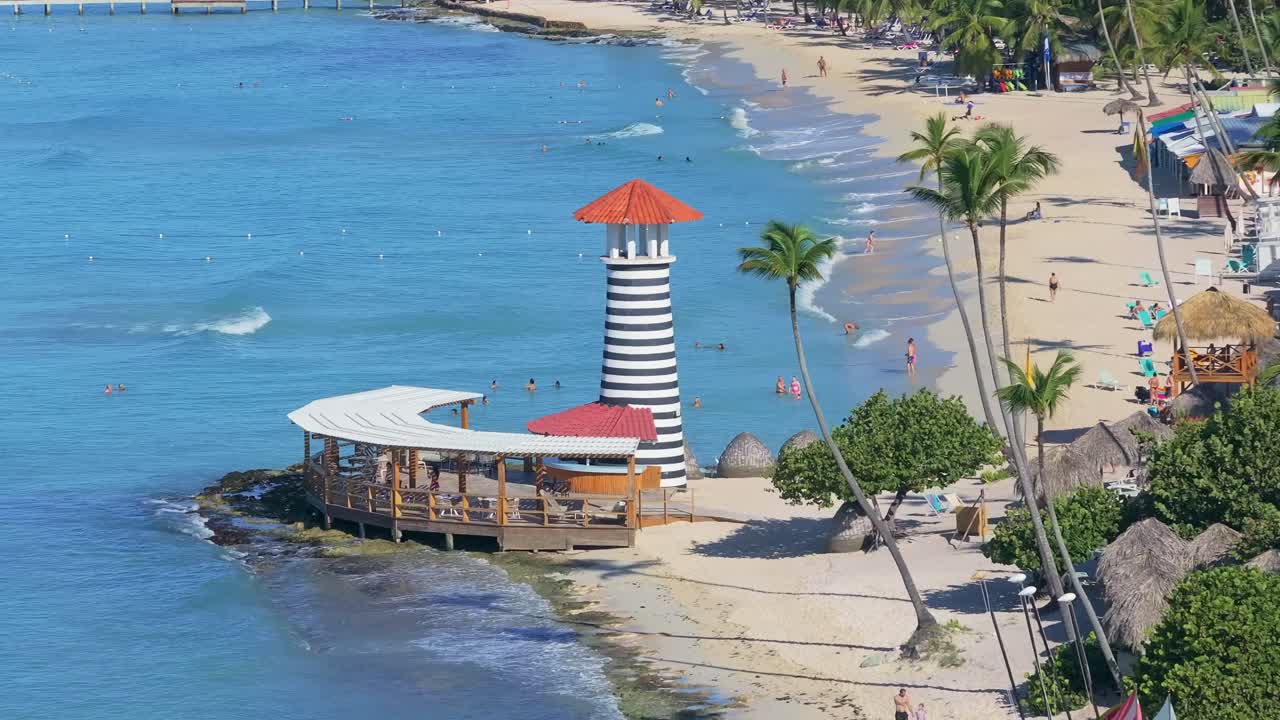 Beautiful Beach with Lighthouse and Palm Trees