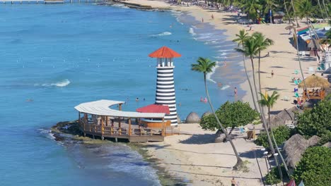 beautiful beach with lighthouse and palm trees
