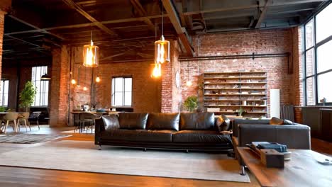 modern loft living room with brick wall and leather couch