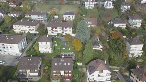 lausanne, residential area of the city, houses with tiled roofs drone aerial view, urban environment, switzerland, vaud