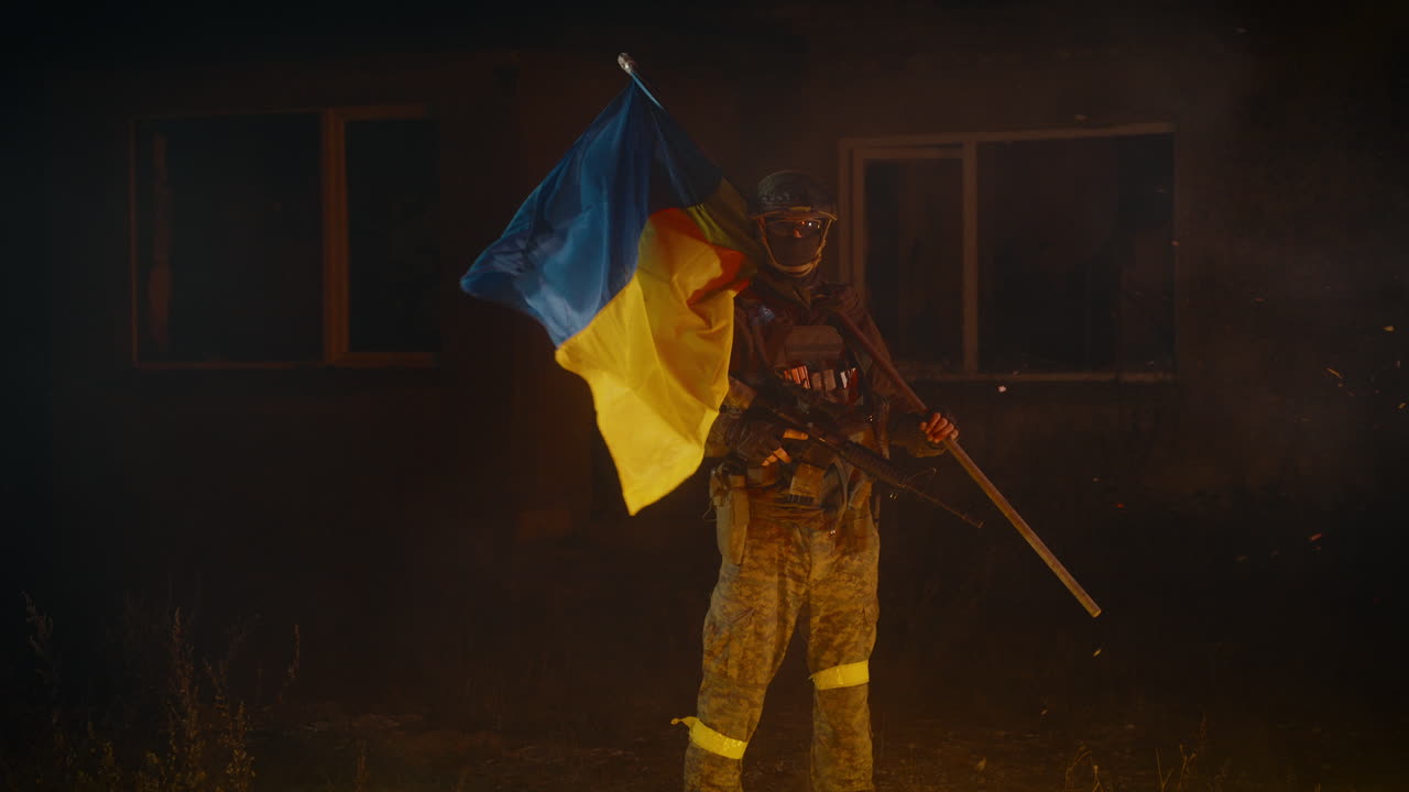 Ukrainian Soldier with Flag in War Zone