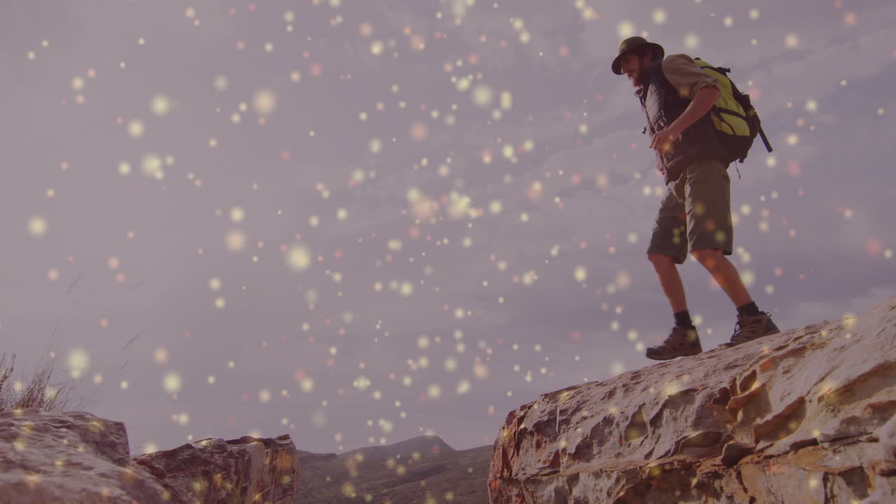 man hiker stepping across rocky plateau under pale sky, with floating travel marketing icons