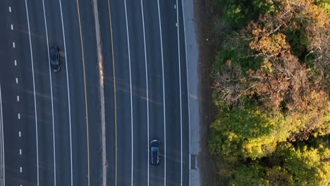 an aerial, top down view over a highway in slow-motion