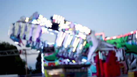 colorful amusement park ride spinning at night