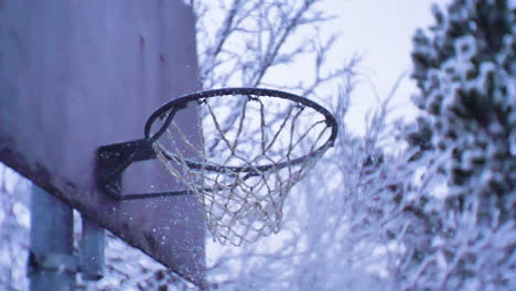 young man dunking a snowball in slow motion