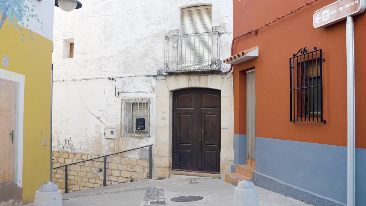 Narrow Street with Colorful Buildings in a Spanish Town