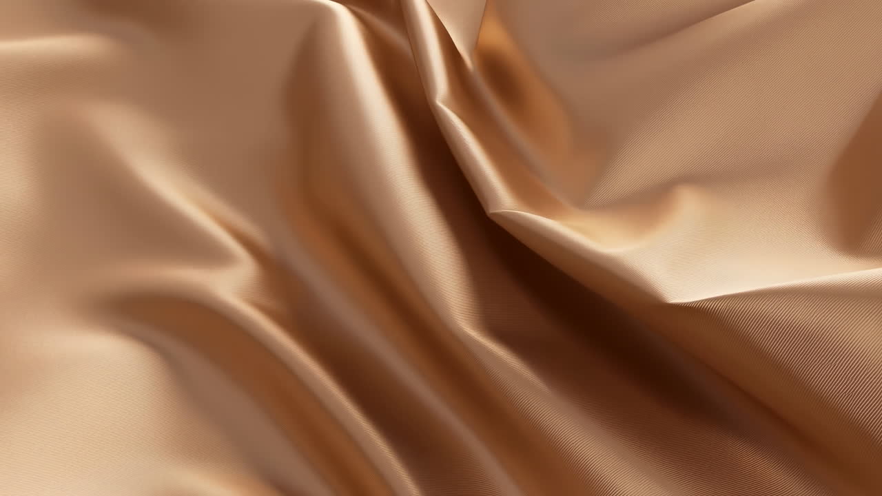 Primo piano di tessuto dorato liscio con pieghe delicate