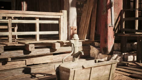 old wooden water pump in rustic barn