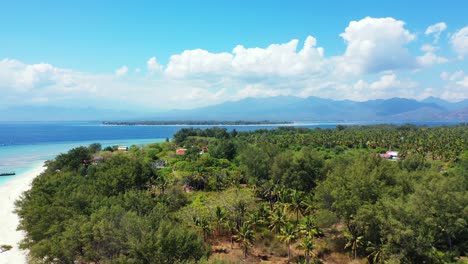 tropical gili island in lombok, aerial panorama, sky and mountains in the background