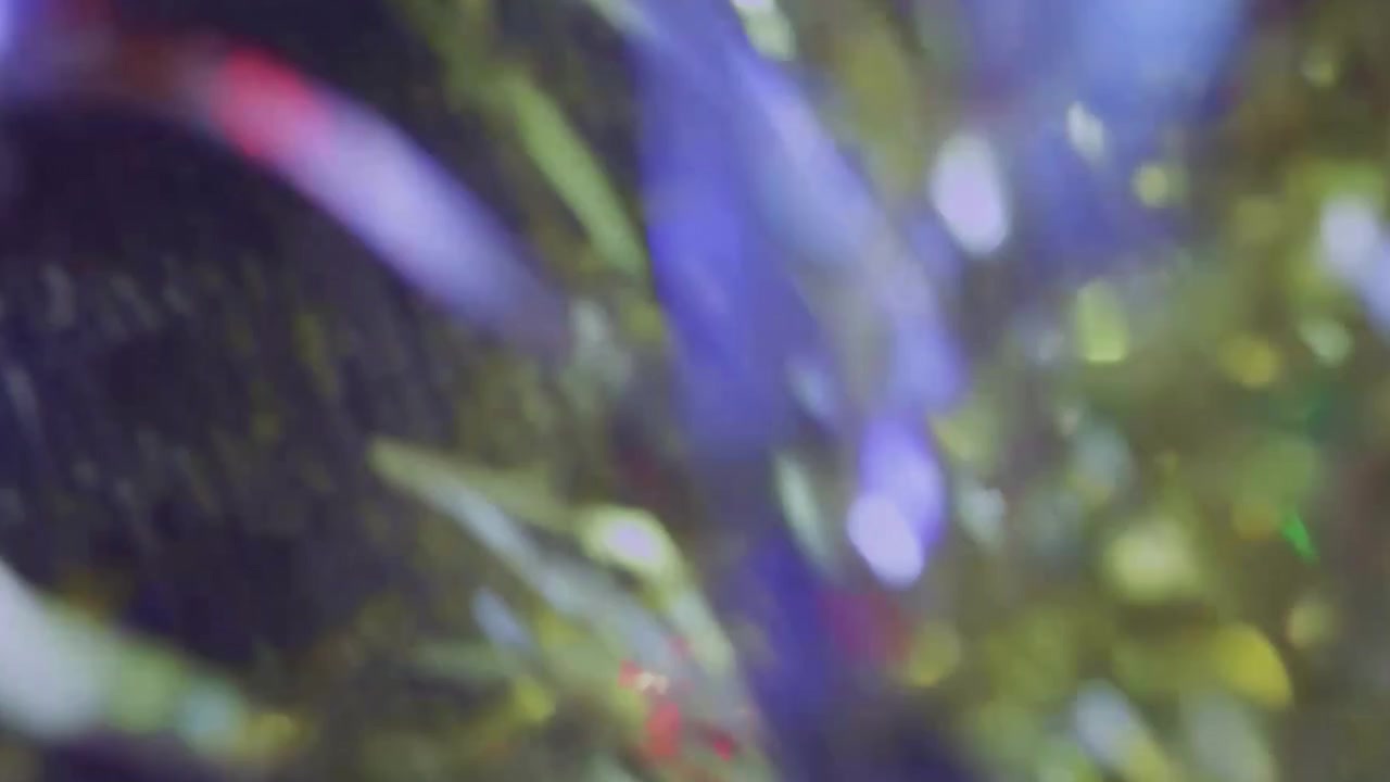 Abstract Light Leaks and Bokeh Reflections on Dark Background