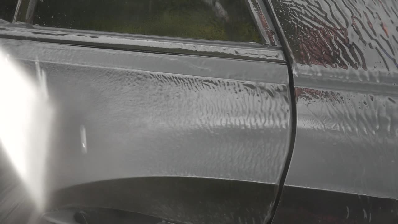 Rinsing bird poop from car