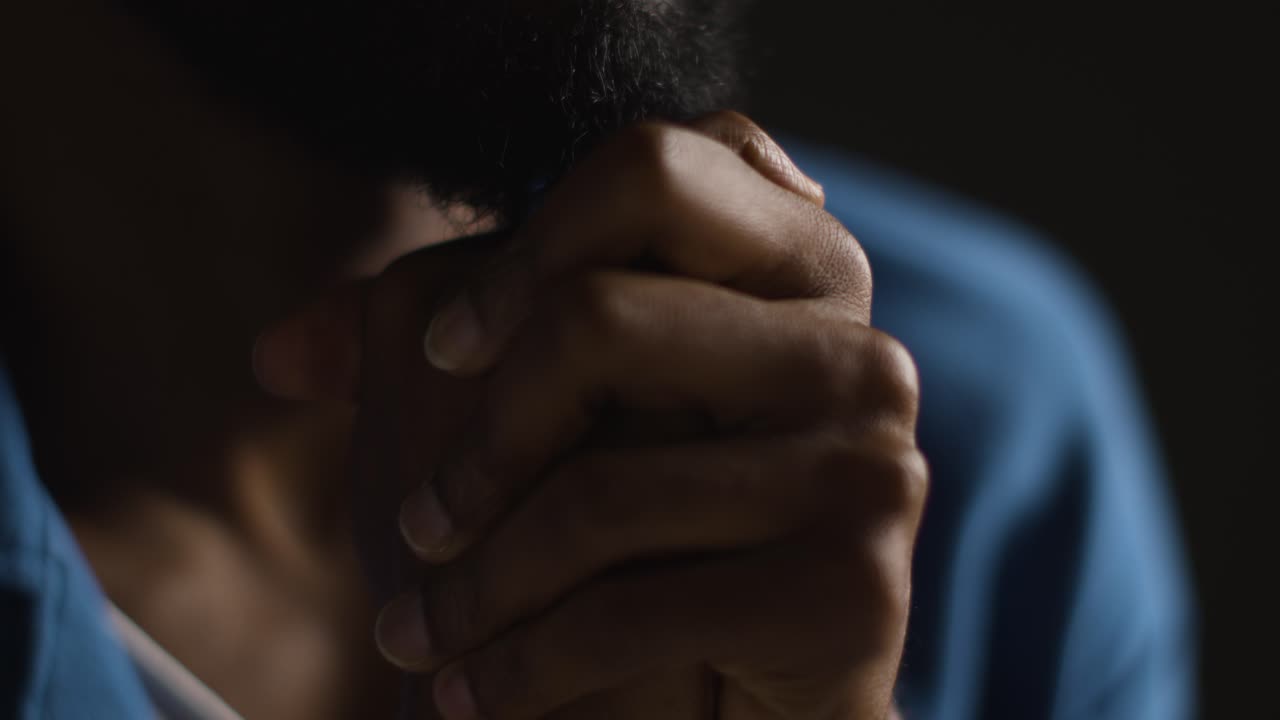 Low Key Close Up Portrait Of Man Struggling With Mental Or Emotional Problems 1