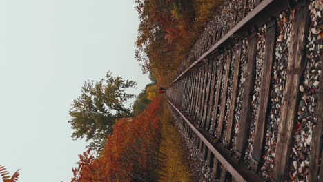 spin shot of railway track with two people walking in the background