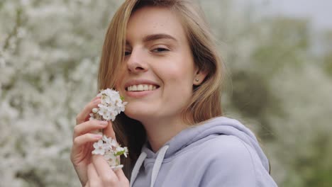 woman enjoying spring flowers