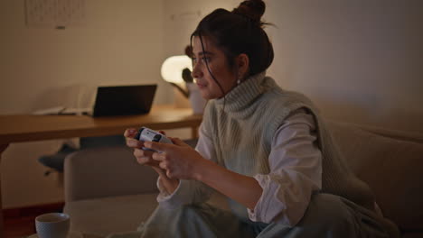 closeup serious lady playing with joystick in late room. gamer woman biting lips