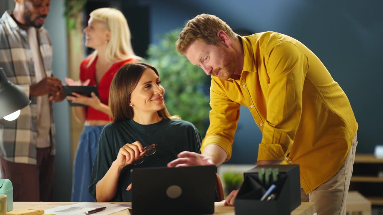 Colleagues Collaborating on a Project in a Modern Office