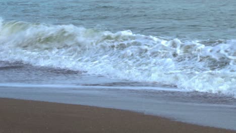 refreshing, cool and crashing waves of ocean - relaxing and perfect summer destination in spain for holidays - close up shot