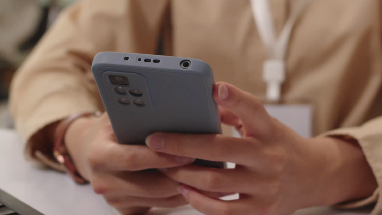 Female Office Worker Using Smartphone