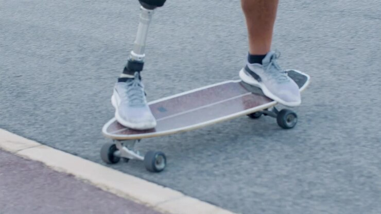 Man with prosthetic leg turning off the pavement on road