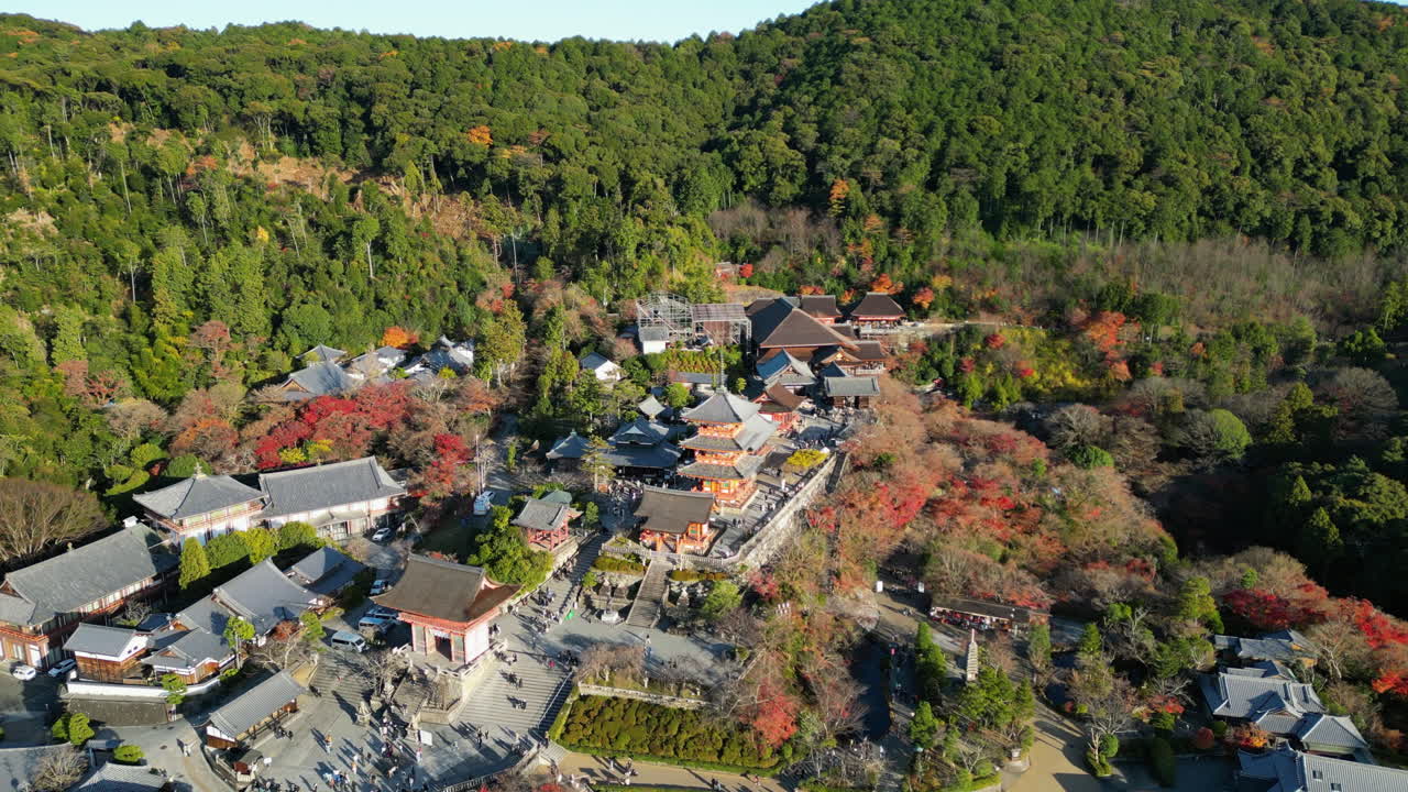 Establishing drone shot of the Kiyomizu-dera temple, sunny, autumn day in Kyoto