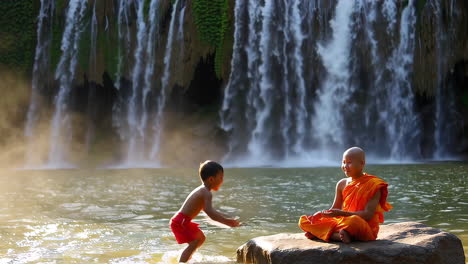 monk and child interacting by a beautiful waterfall