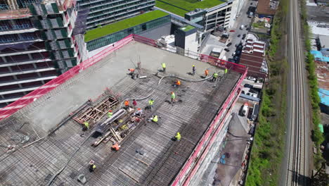 construction workers and highway traffic in city