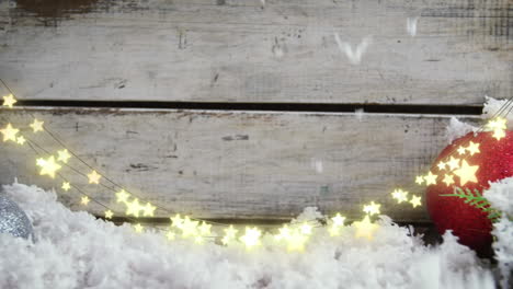 animation of star string lights, snow and christmas bauble