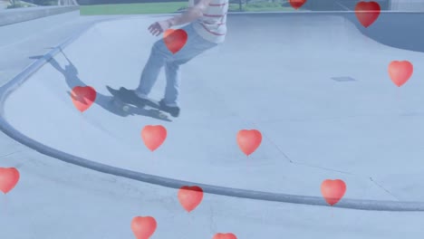 animación de globos en forma de corazón sobre un niño caucásico haciendo skateboard