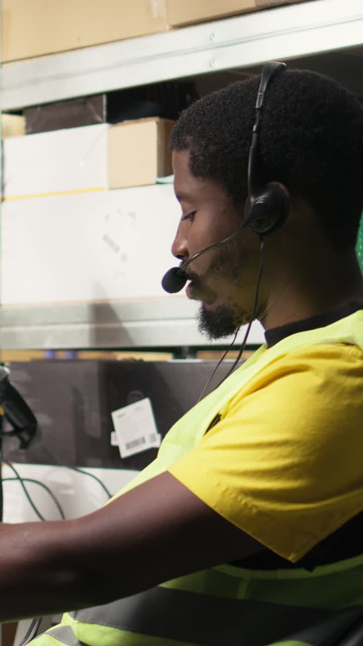 Vertical Video African american operator helping clients with delivery issues