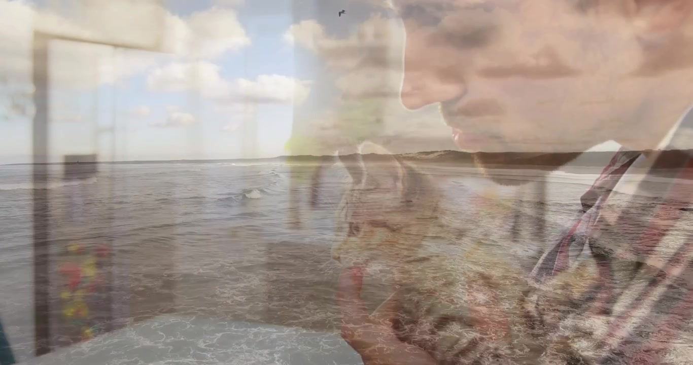 Åbnende havbølger overlejrer en voksen mand, der løfter en killing ved et vindue, hvilket viser kærlig kæledyrspleje.