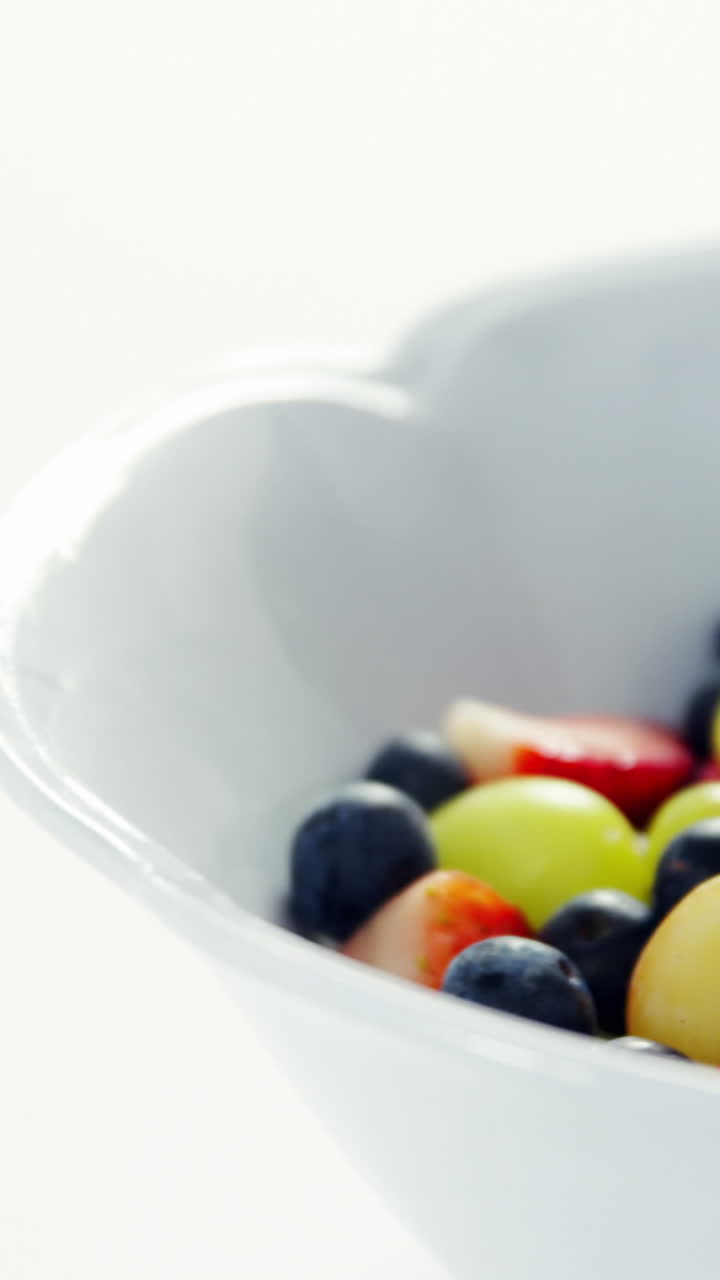 Various fruits and herbs in bowl