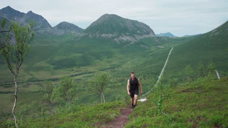 Close-Up-of-a-Hiker-in-Salberget-Hill-in-Flakstadvåg,-Norway