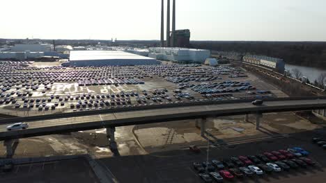 aerial low flying over cars at general motors plant