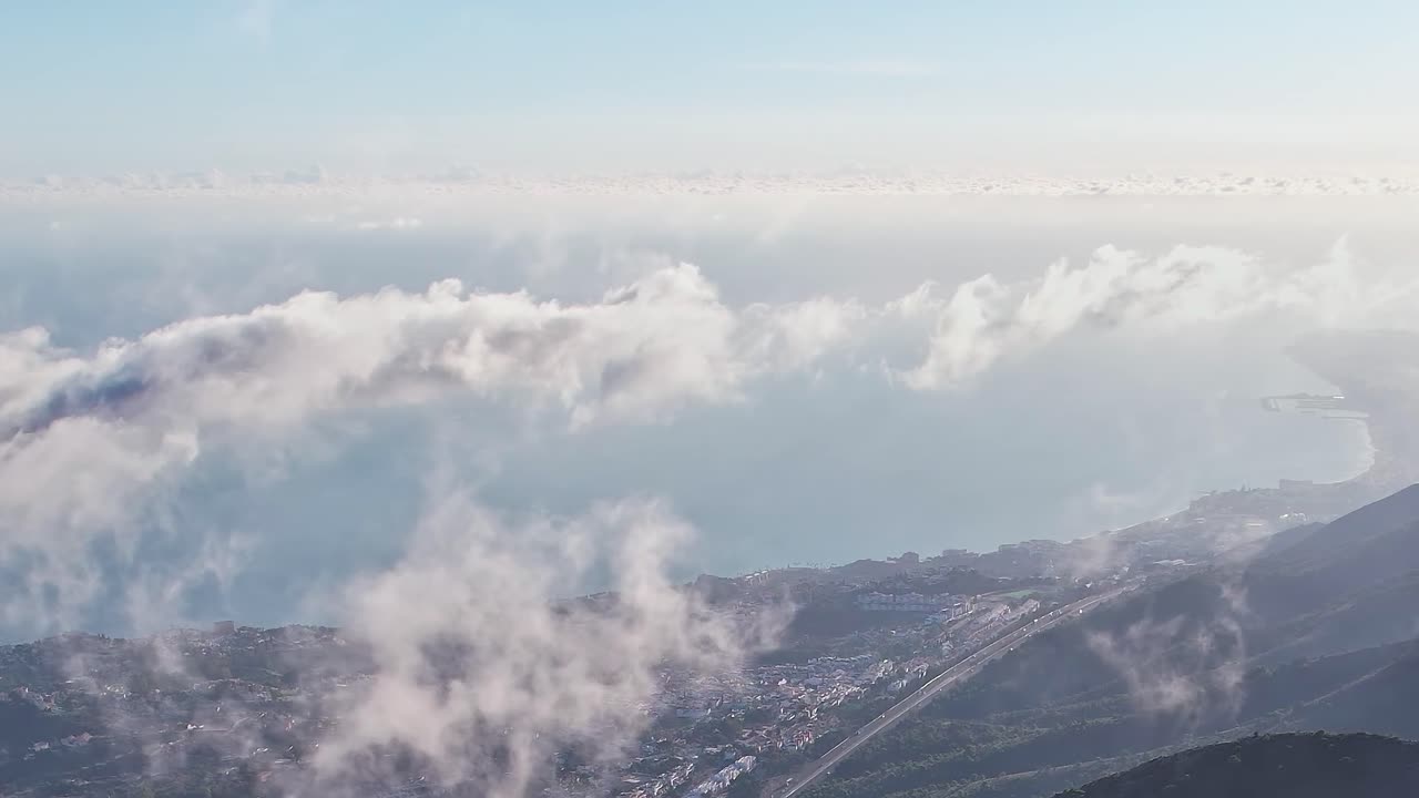 View of Malaga coastline with clouds and sky above
