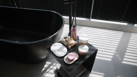 modern black bathtub with spa accessories