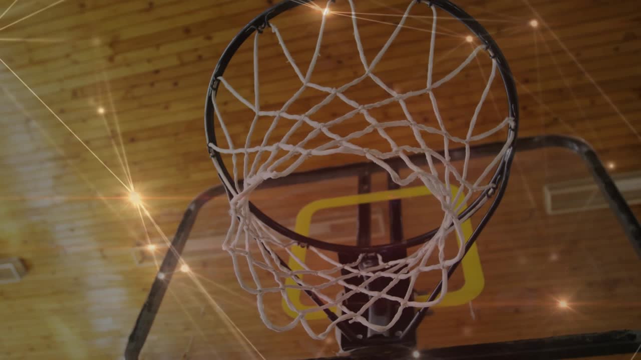 Camera pulling back, rim settling, net shifting, glowing overlay brightening, revealing backboard