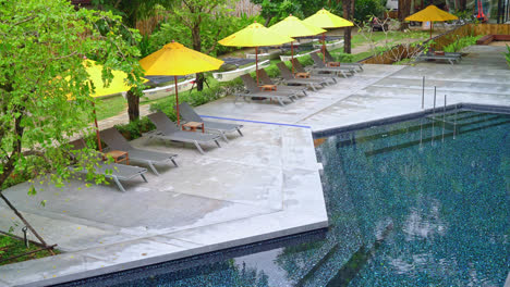 umbrella and pool bed decoration around swimming pool in hotel resort