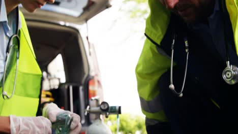 emergency medical technician taking car an injured man