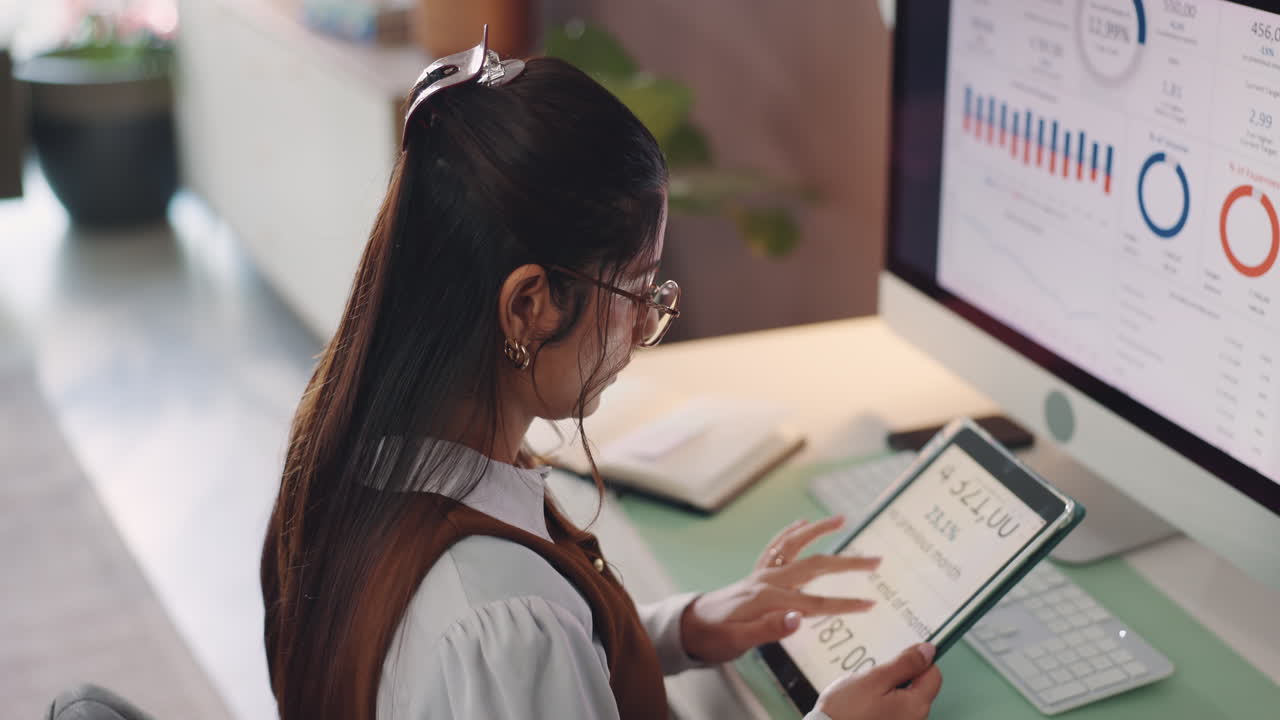Businesswoman Analyzing Data in Office