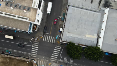 Aerial-view-of-traffic-in-middle-of-unhoused-people-on-the-streets-of-Skid-Row,-LA