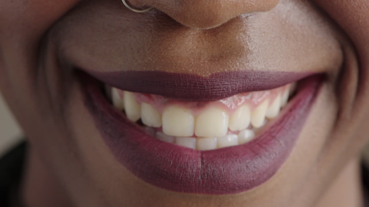 close up beautiful african american woman lips smiling happy mouth showing healthy teeth