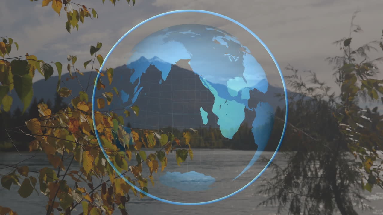 Globe animation over scenic river landscape with autumn foliage and mountains