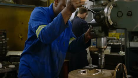 metalsmith working in workshop 4k