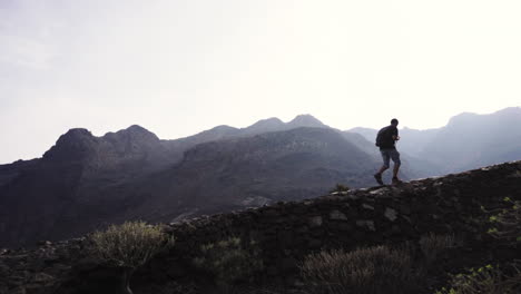 hiker braving the steep alps of tenerife island spain