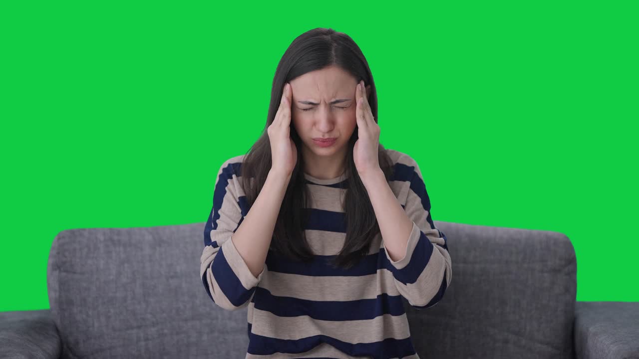 Sick Indian girl suffering from Headache Green screen