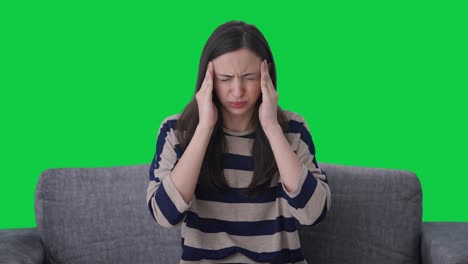 sick indian girl suffering from headache green screen