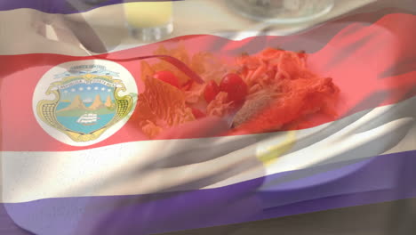 Preparing colorful salad with vegetables and fruits, Costa Rica flag overlay animation